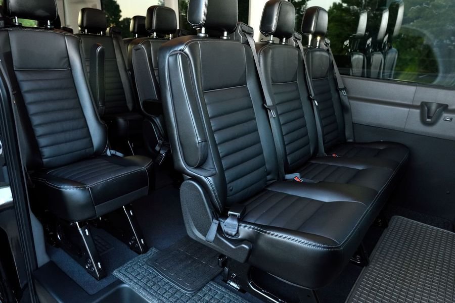 Push-back seating inside a tempo traveller hired in Mangalore